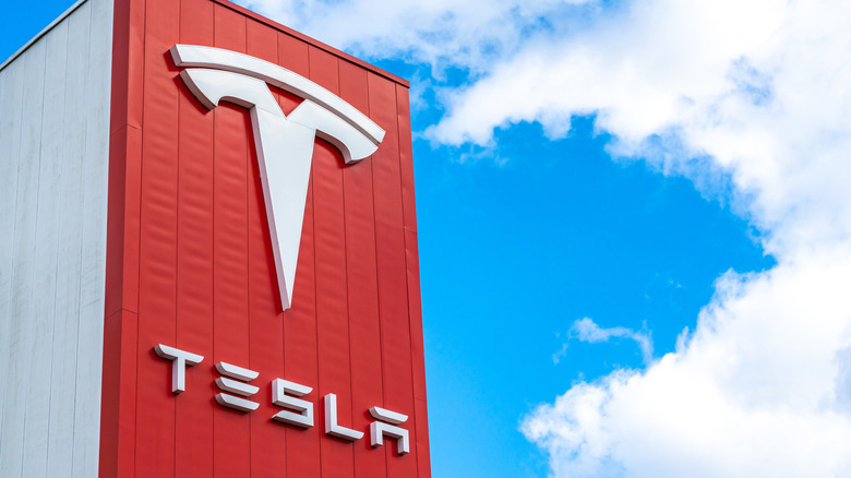 Tesla logo on a building during daytime