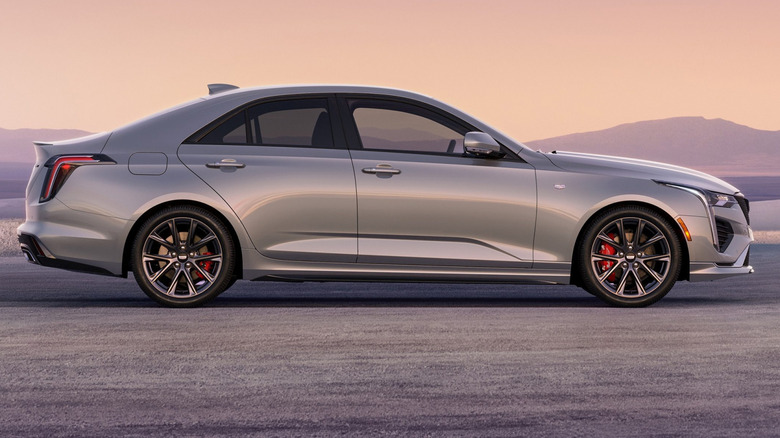 Side view of silver Cadillac CT4 in mountain setting