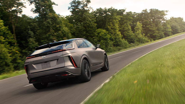 Rear-quarter shot of a Cadillac Lyriq driving