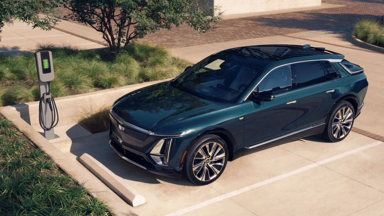 A dark green 2026 Cadillac Lyriq parked at EV charger