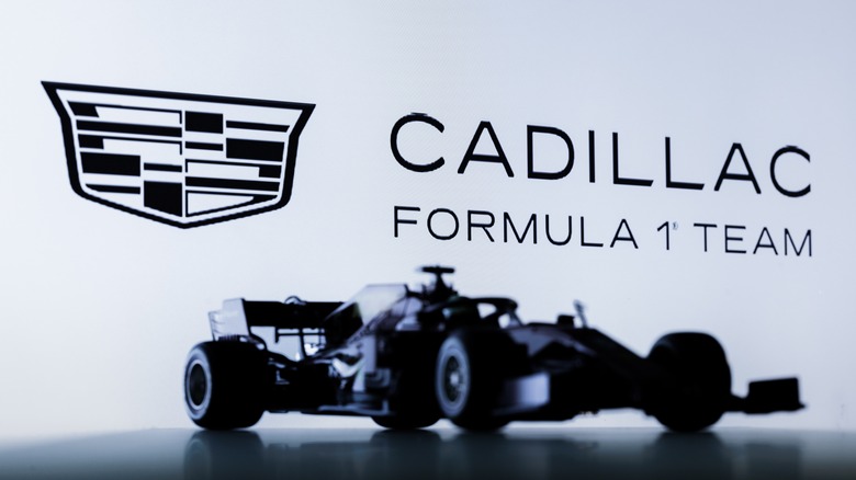 Silhouette of Cadillac 2026 Formula One car in front of logo