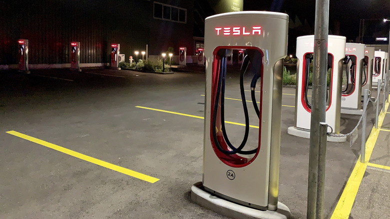 Parking lot full of Tesla charging stations