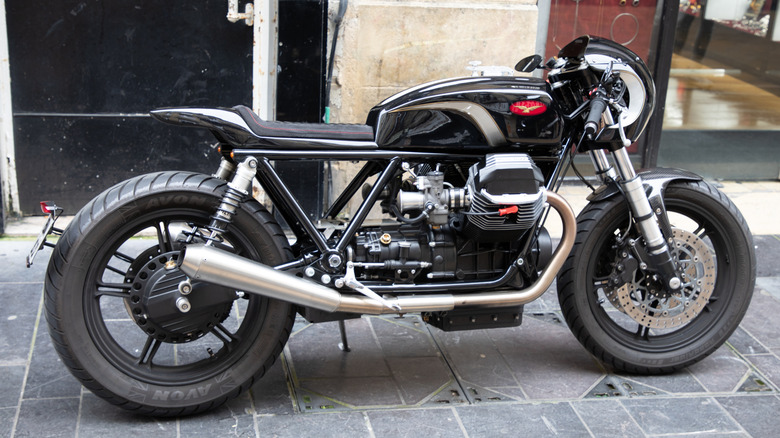Side view of a cafe racer-style black Moto Guzzi