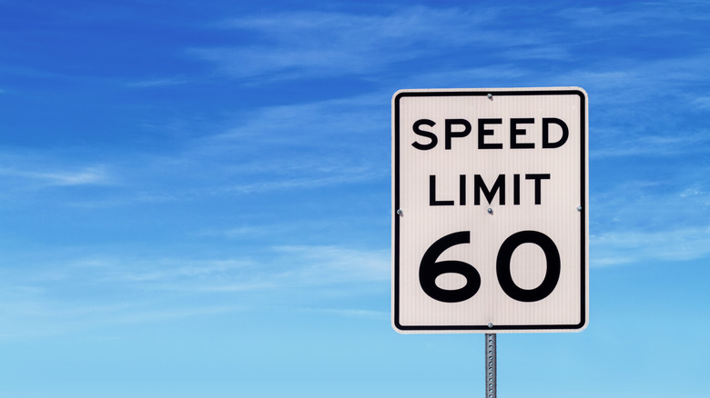 60 mph speed limit sign against a blue sky