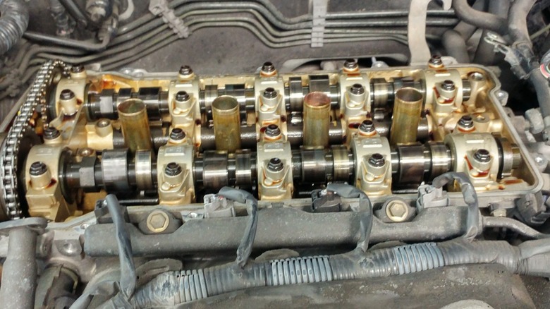 Dual overhead camshafts inside an engine open for inspection.