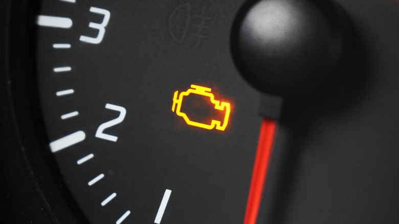 The instrument cluster featuring an illuminated check engine light