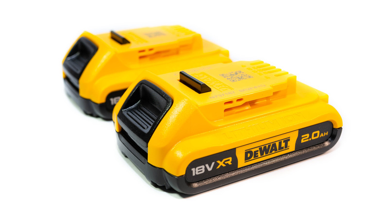 Two DeWalt batteries on a white background