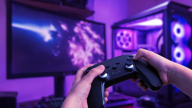 A person playing games on a gaming PC