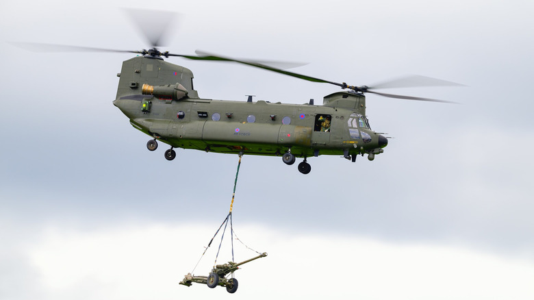 RAF Chinook helicopter carrying artillery during an RAF demonstration