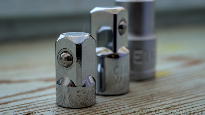 3 socket adapters placed on table top