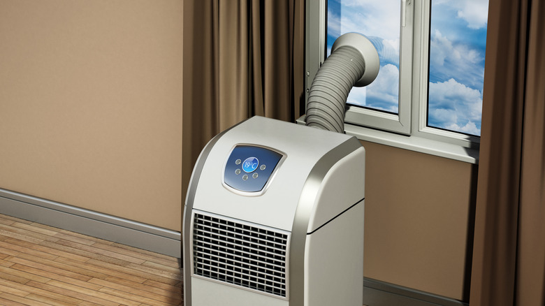 Graphic of portable air conditioner in window.