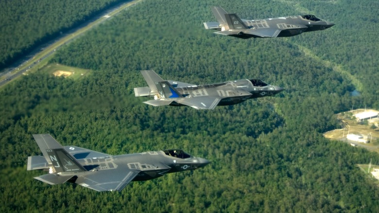 Three F-35As flying over forests near Eglin AFB