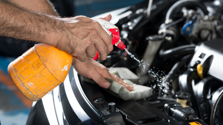Cleaning car engine with spray cleaner