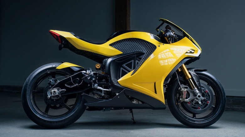 A yellow Damon HyperSport on its stand