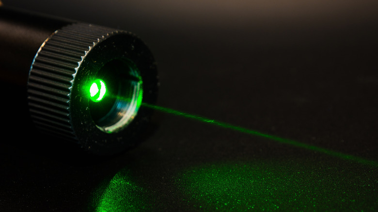 Close-up of green laser pointer.