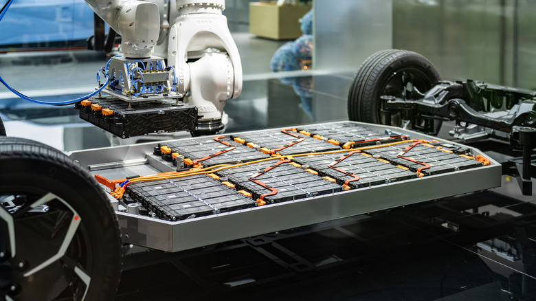 Robot assembling battery for electric car.