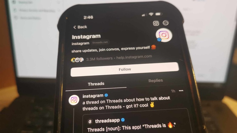 Threads app against laptop