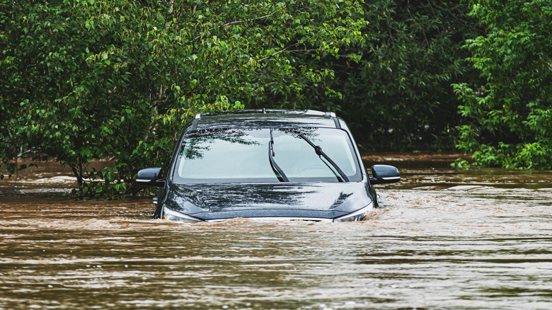 vehicle sits in water following flooding