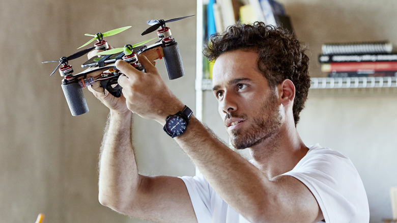 Man building drone