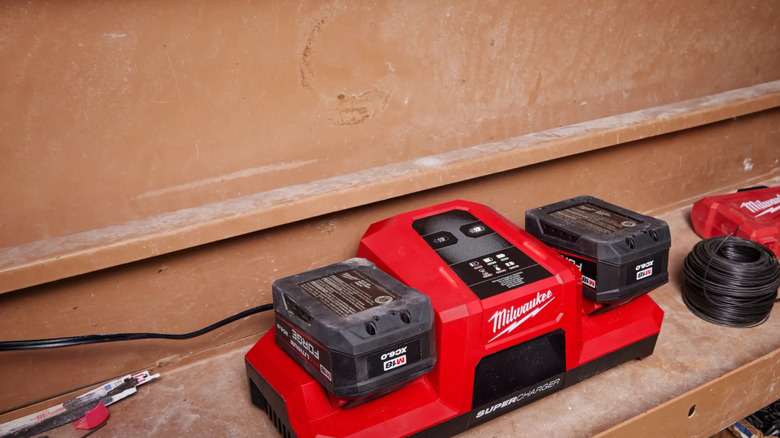 A Milwaukee Dual-Bay Super Charger charging M18 Forge batteries