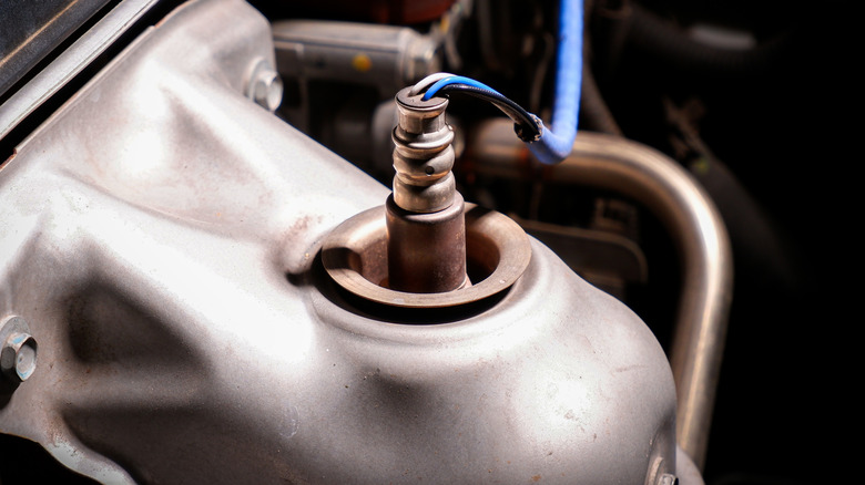 Close-up of upstream oxygen sensor installed in car