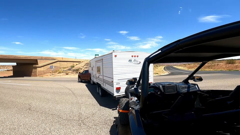 Pickup double towing an RV and vehicle trailer