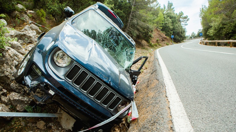 jeep wrangler crashed on side of the road