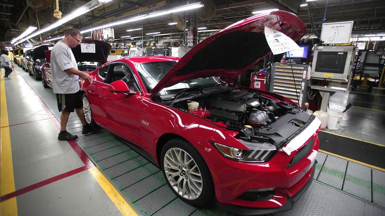 Red Ford Mustang GT on assembly line