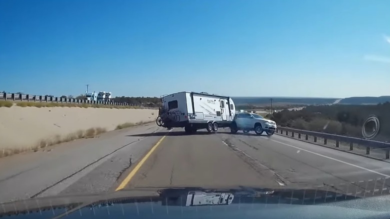 An SUV Pulling An RV Losing Control Following Trailer Sway