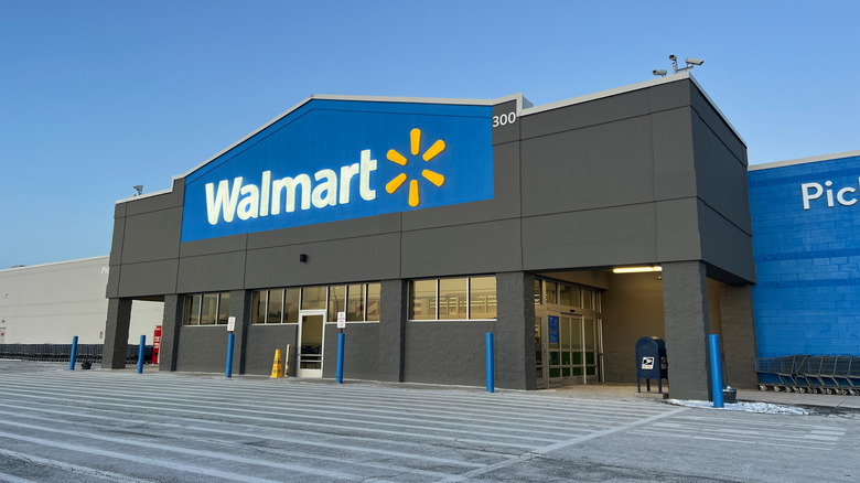 The front of a Walmart store with a large Walmart logo