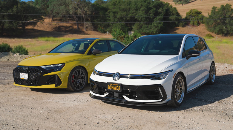 A yellow Audi RS3 next to a lightly modified white Mk8 Volkswagen Golf R