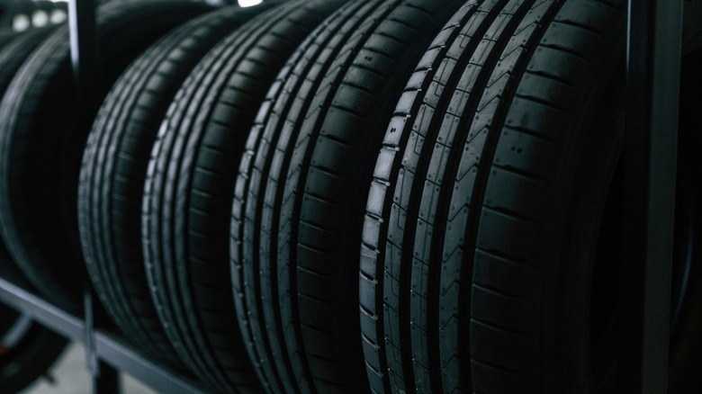 A row of new car tires on display