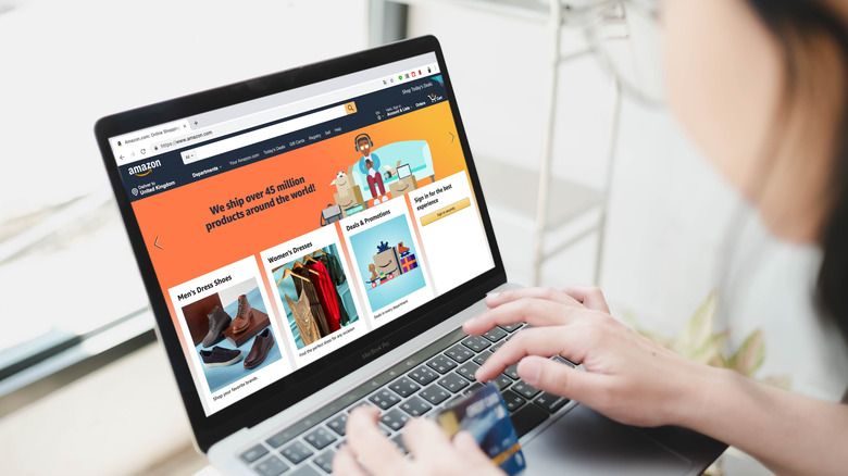 woman shopping on amazon using laptop