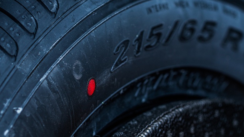 A red dot found on a tire's sidewall.