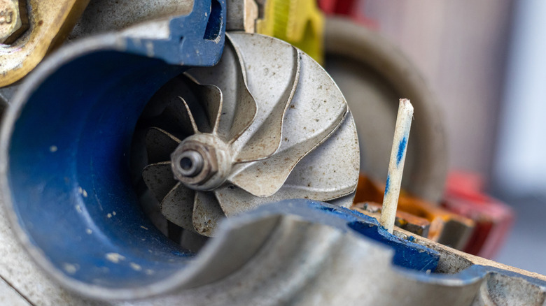 Detail view of cutaway turbocharger showing turbine and housing