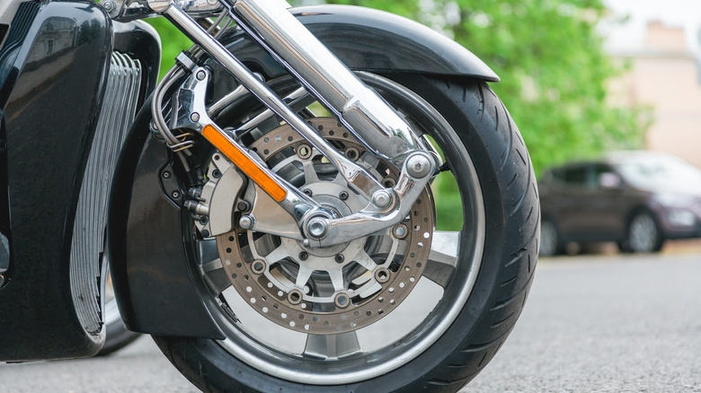 Front fork of a motorcycle sporting a normal motorcycle tire