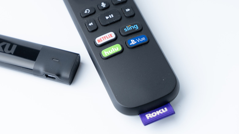 roku streaming stick and remote placed against a white background