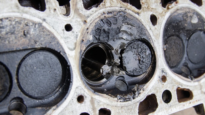 A damaged cylinder head that should be replaced.
