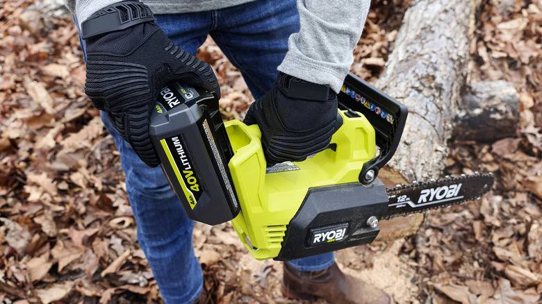 Ryobi 40V battery inserted into cordless chainsaw