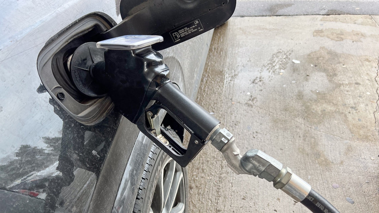 Close up view of a fuel pump nozzle in vehicle's gas tank