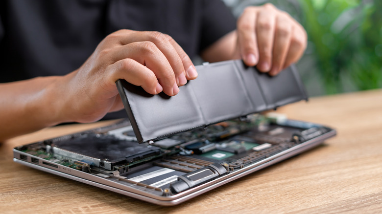Taking out a laptop's battery