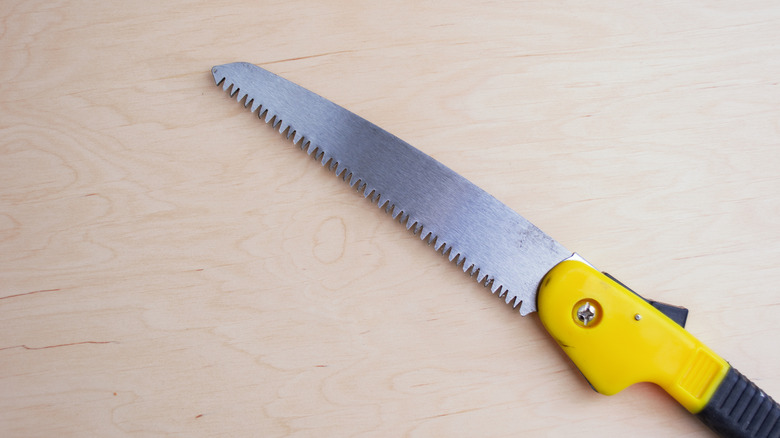 A portable utility saw shown open on a table