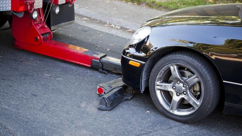 Tow truck getting ready to tow a car