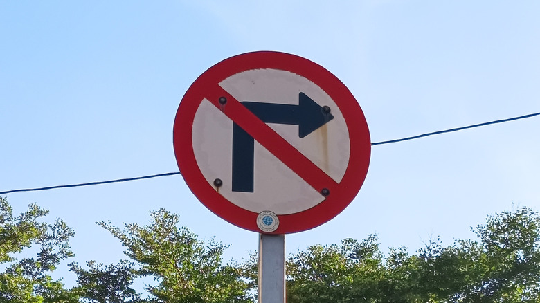 A traffic sign indicating no right turns.