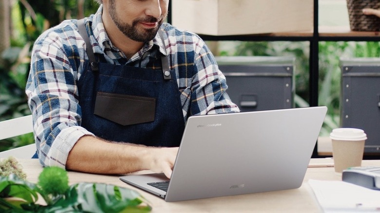 Man using ASUS Chromebook in workshop office