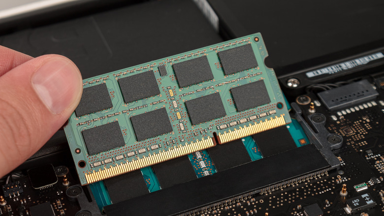 Inserting RAM module into a laptop RAM slot