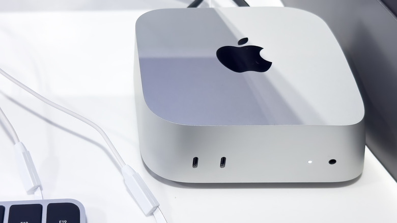Mac Mini on a table connected to a display