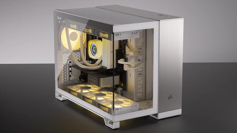 A yellow RGB themed pc in a white dual-chamber fishtank case