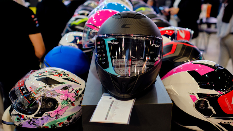 Motorbike helmets on display