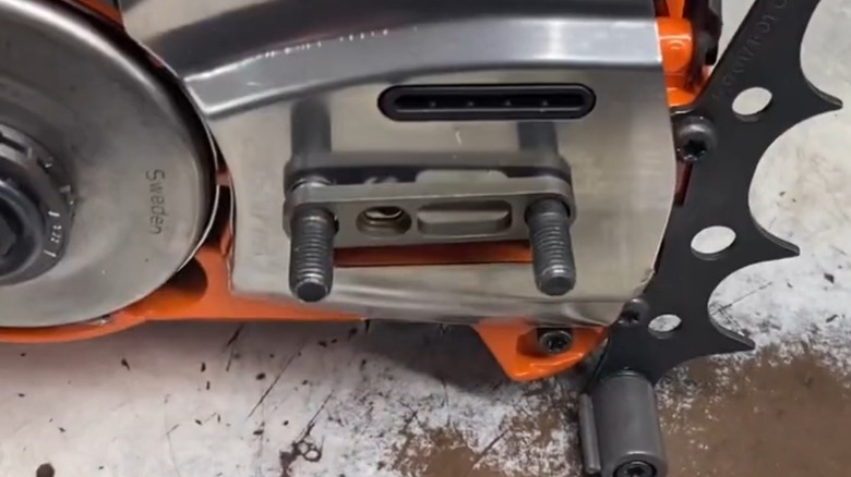 A Husqvarna chainsaw with an adapter attached.